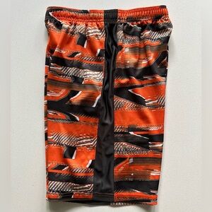 Under Armour Orange and gray patterned shorts in size YL